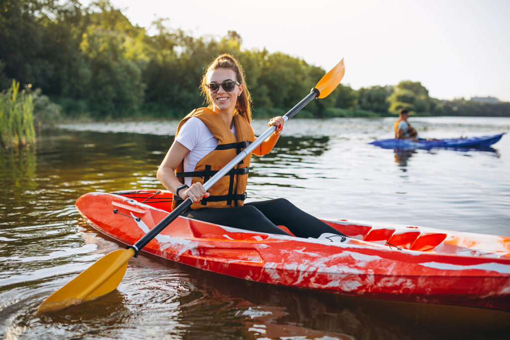 couple-together-kayaking-river